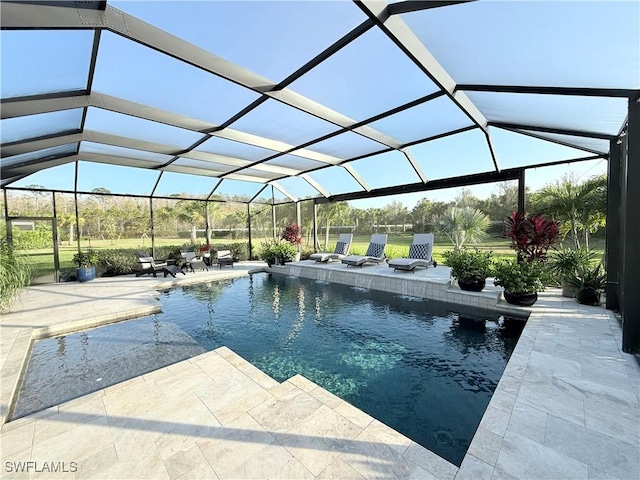 pool with glass enclosure and a patio