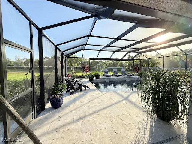 view of patio / terrace with a lanai and an outdoor pool