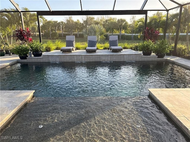 pool featuring a lanai and a patio