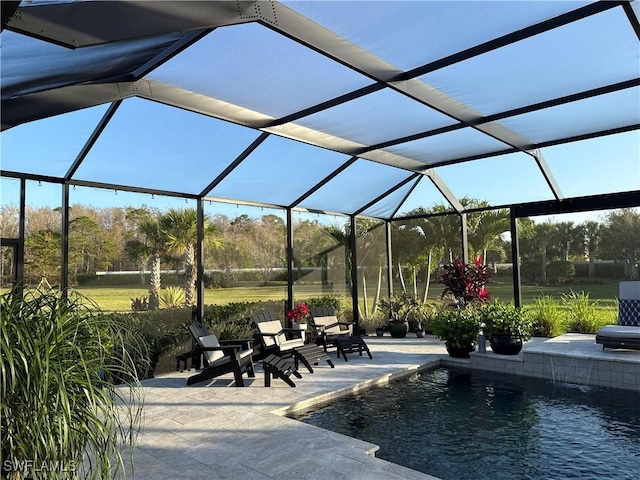 view of patio / terrace with a lanai and an outdoor pool