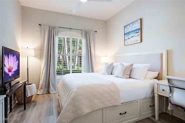 bedroom with light wood-style flooring and a ceiling fan