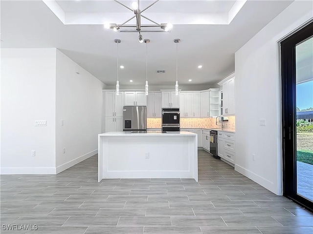 kitchen with dobule oven black, decorative backsplash, light countertops, stainless steel refrigerator with ice dispenser, and a sink