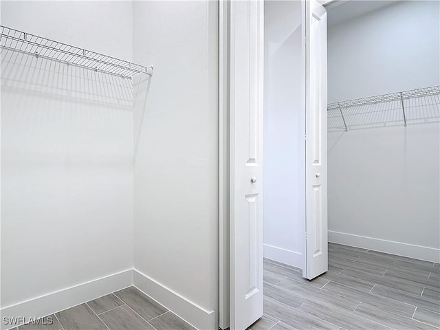 spacious closet with wood tiled floor