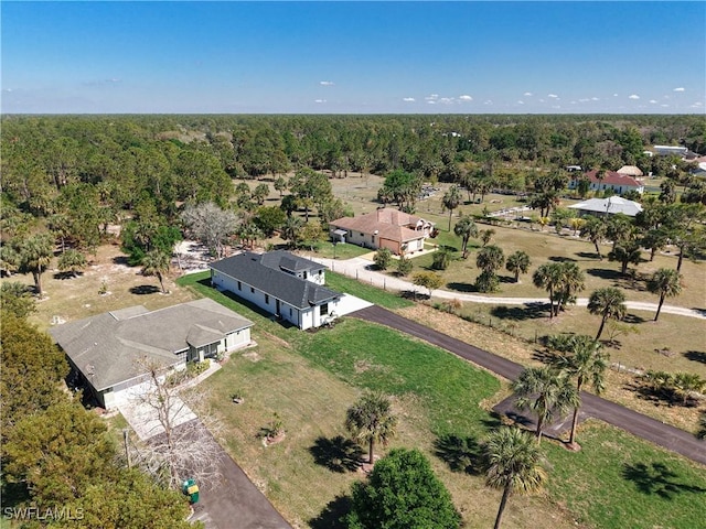 aerial view with a wooded view