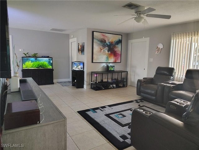 living area featuring light tile patterned floors, visible vents, and a ceiling fan