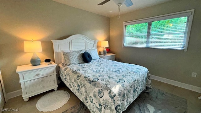 bedroom featuring ceiling fan and baseboards