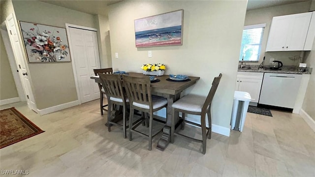 dining space with baseboards