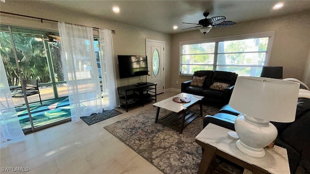 living room featuring a ceiling fan and recessed lighting