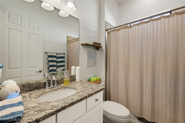 full bath with a shower with curtain, toilet, and vanity