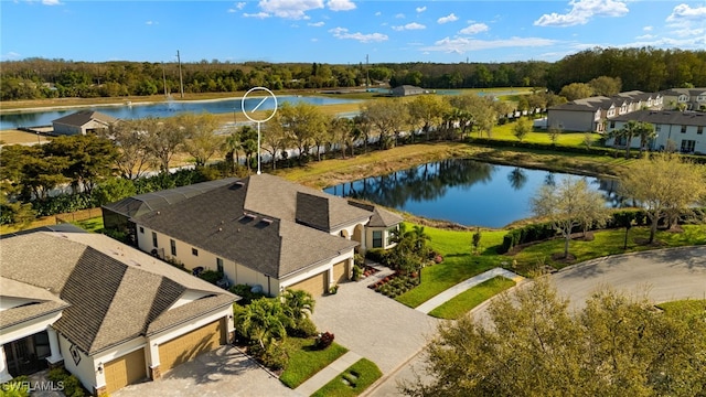 drone / aerial view with a water view