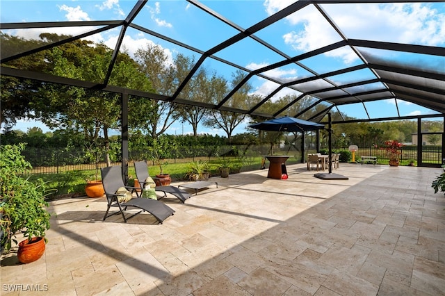 view of patio / terrace featuring a lanai