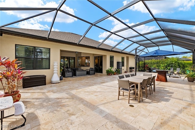 view of patio featuring outdoor dining area, glass enclosure, and an outdoor living space