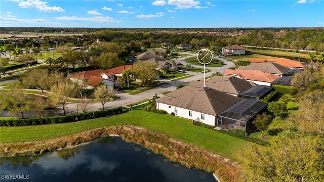 bird's eye view with a residential view and a water view