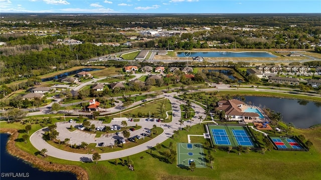 drone / aerial view featuring a water view and a residential view