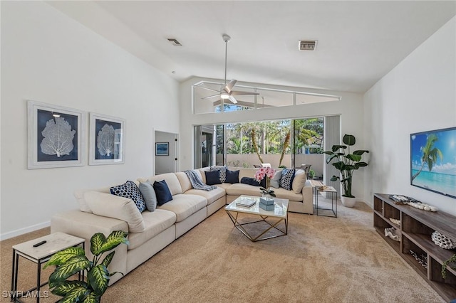 carpeted living room featuring visible vents, baseboards, high vaulted ceiling, and a ceiling fan