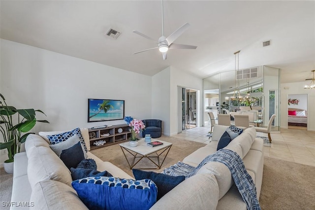 27145 Lost Lake Ln, Bonita Springs, FL 34134 - living area featuring light tile patterned flooring, visible vents, and vaulted ceiling