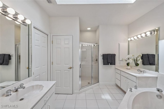 27145 Lost Lake Ln, Bonita Springs, FL 34134 - bathroom featuring tile patterned flooring, a stall shower, two vanities, and a sink