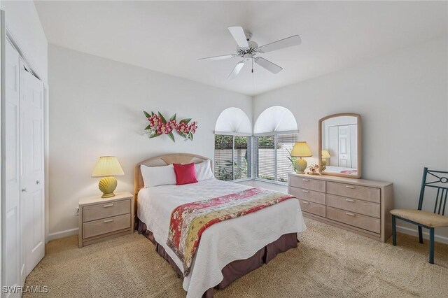 27145 Lost Lake Ln, Bonita Springs, FL 34134 - bedroom with a closet, baseboards, light colored carpet, and ceiling fan