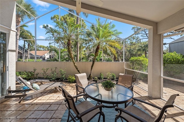 27145 Lost Lake Ln, Bonita Springs, FL 34134 - view of patio featuring outdoor dining area, a lanai, and fence