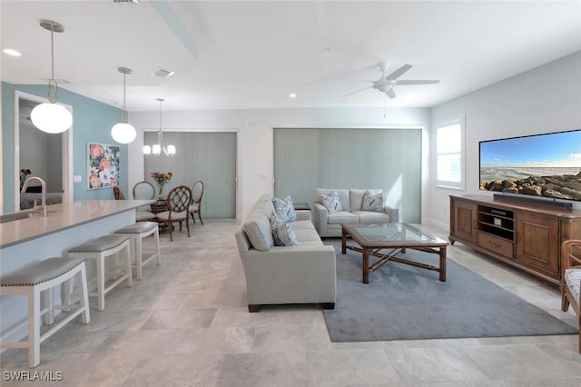 living area featuring visible vents, ceiling fan, and recessed lighting
