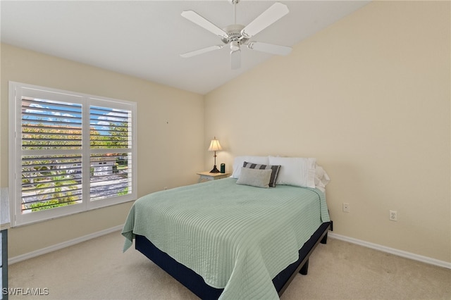 carpeted bedroom featuring vaulted ceiling, baseboards, and ceiling fan