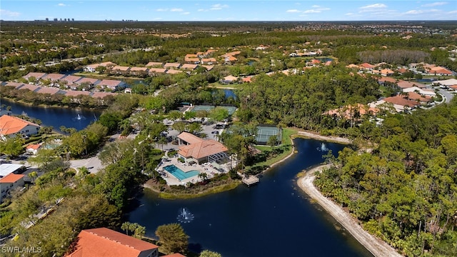 drone / aerial view featuring a residential view and a water view