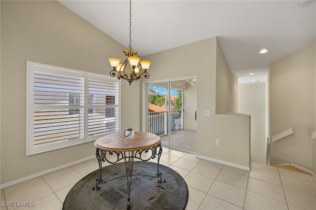 dining room featuring vaulted ceiling, light tile patterned floors, baseboards, and a chandelier