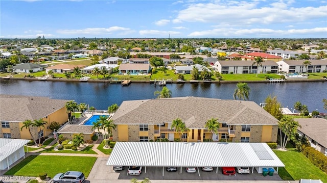 aerial view with a residential view and a water view