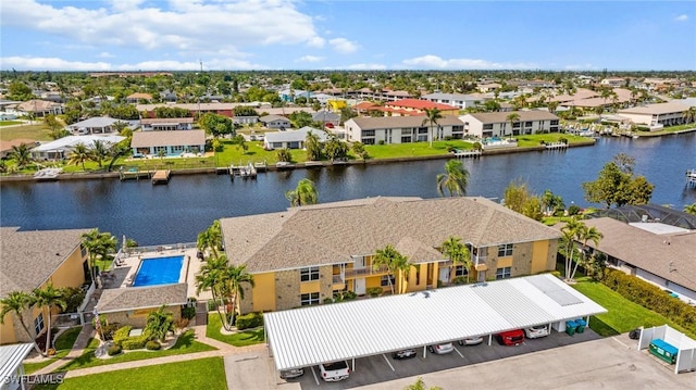 aerial view with a water view and a residential view