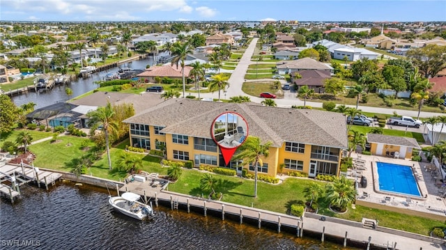 bird's eye view with a water view and a residential view