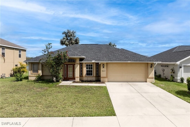 view of front of house featuring driveway, an attached garage, a front yard, and stucco siding