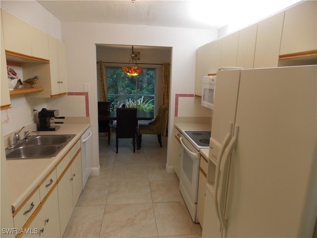 kitchen with open shelves, light countertops, decorative backsplash, a sink, and white appliances