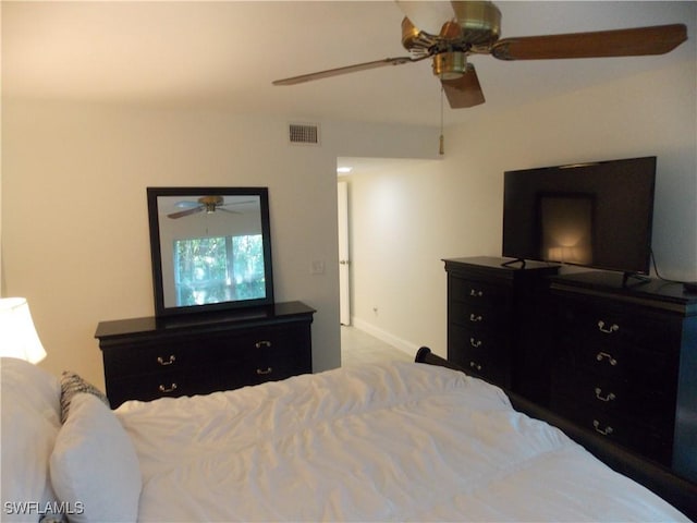 bedroom featuring a ceiling fan, visible vents, and baseboards