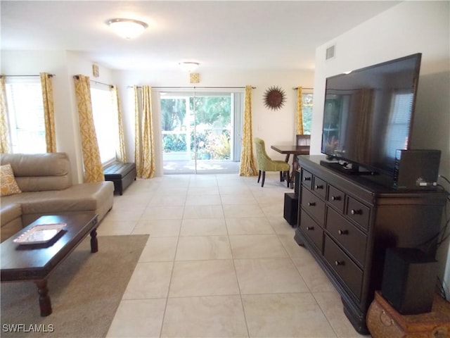 living room with visible vents and light tile patterned flooring