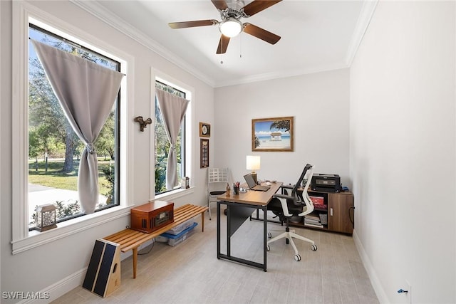 office area featuring light wood-type flooring, ceiling fan, baseboards, and crown molding