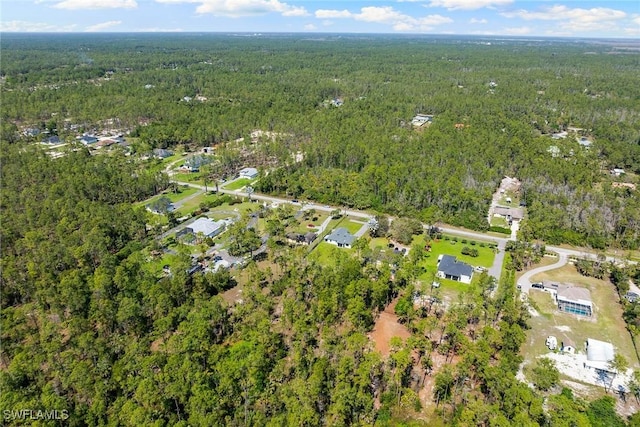 aerial view with a wooded view