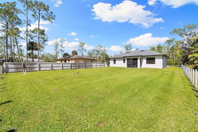 view of yard with a fenced backyard