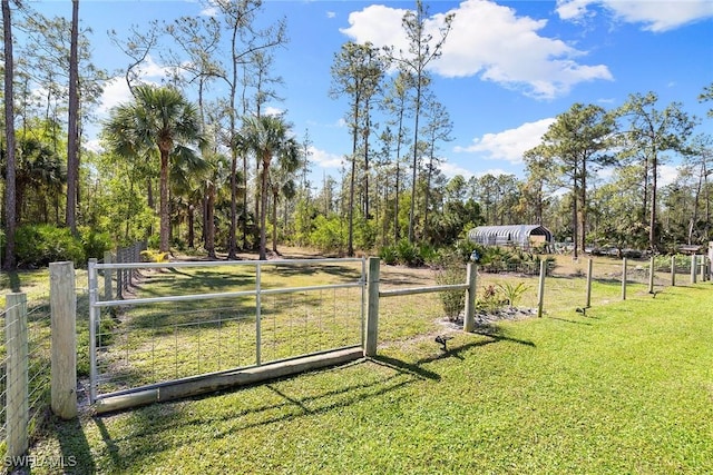 view of yard with fence and a gate