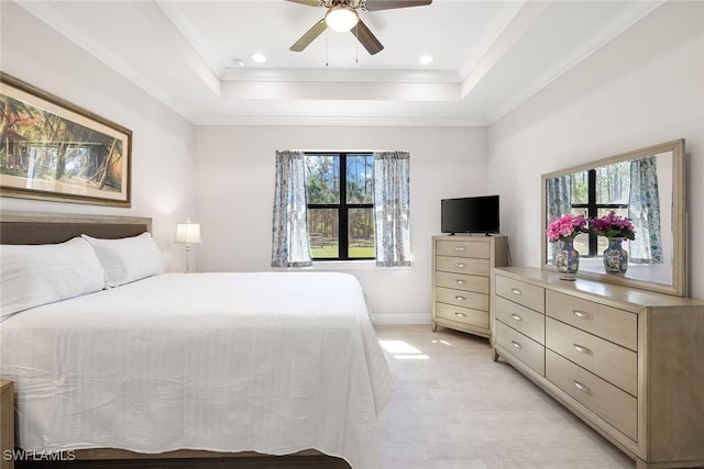 bedroom with recessed lighting, a ceiling fan, baseboards, ornamental molding, and a tray ceiling