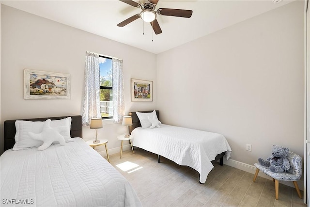 bedroom featuring a ceiling fan and baseboards