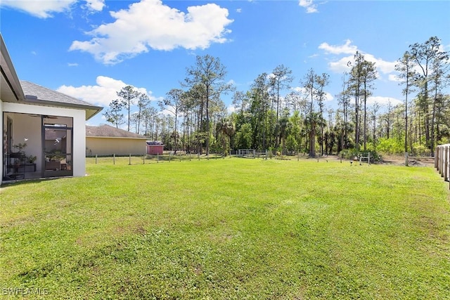 view of yard featuring fence