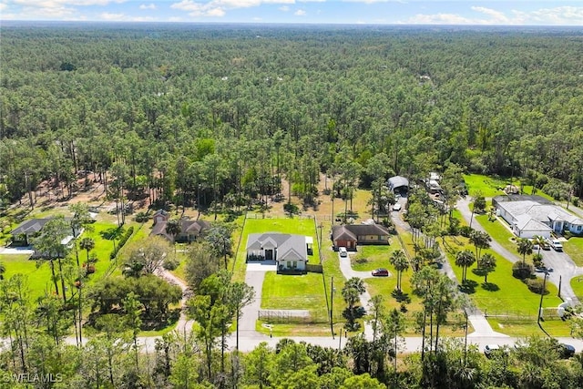 aerial view with a wooded view