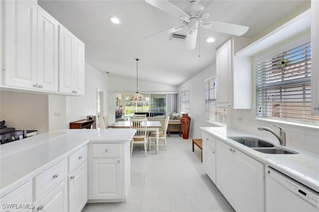 kitchen featuring light tile patterned floors, light countertops, visible vents, a sink, and dishwasher