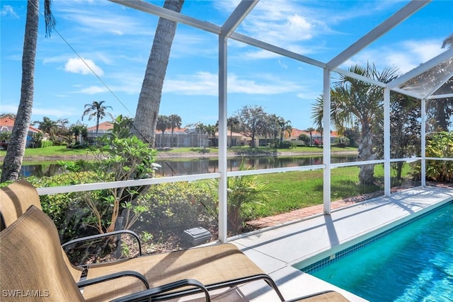 unfurnished sunroom featuring a water view