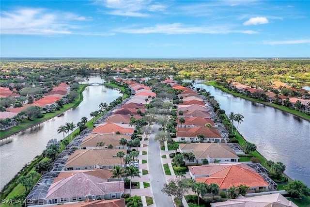 birds eye view of property featuring a residential view and a water view