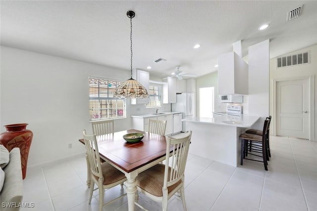 dining area featuring recessed lighting, visible vents, and light tile patterned floors