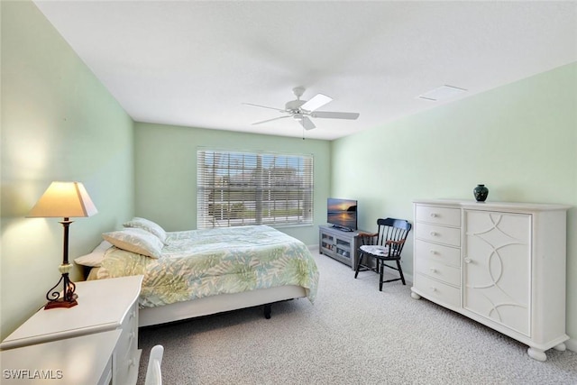 bedroom with light colored carpet and ceiling fan