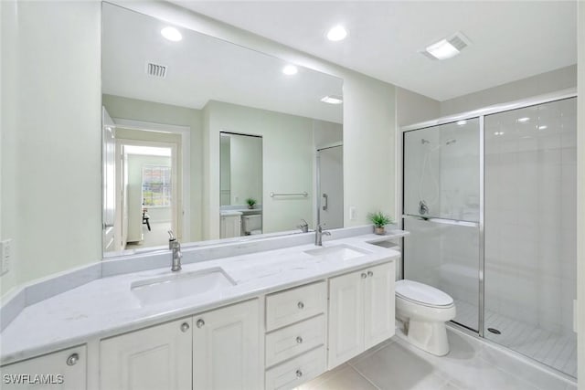 full bath featuring toilet, tile patterned flooring, a sink, and visible vents