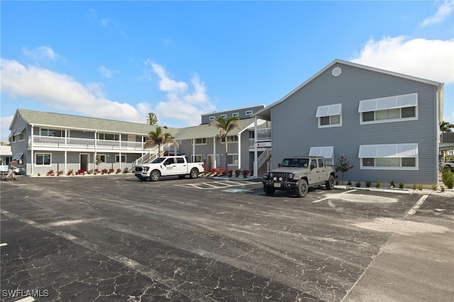 view of building exterior featuring uncovered parking