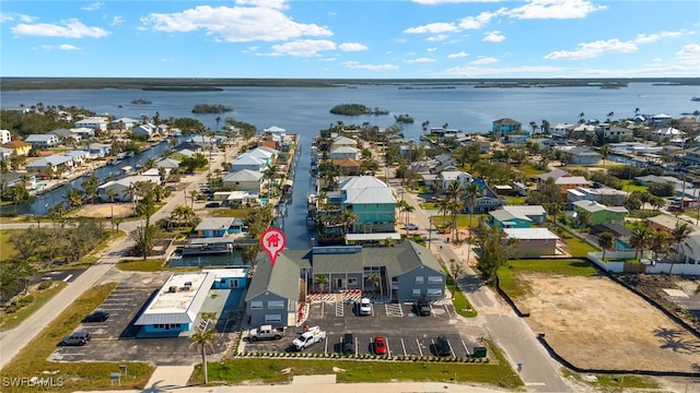 aerial view featuring a residential view and a water view